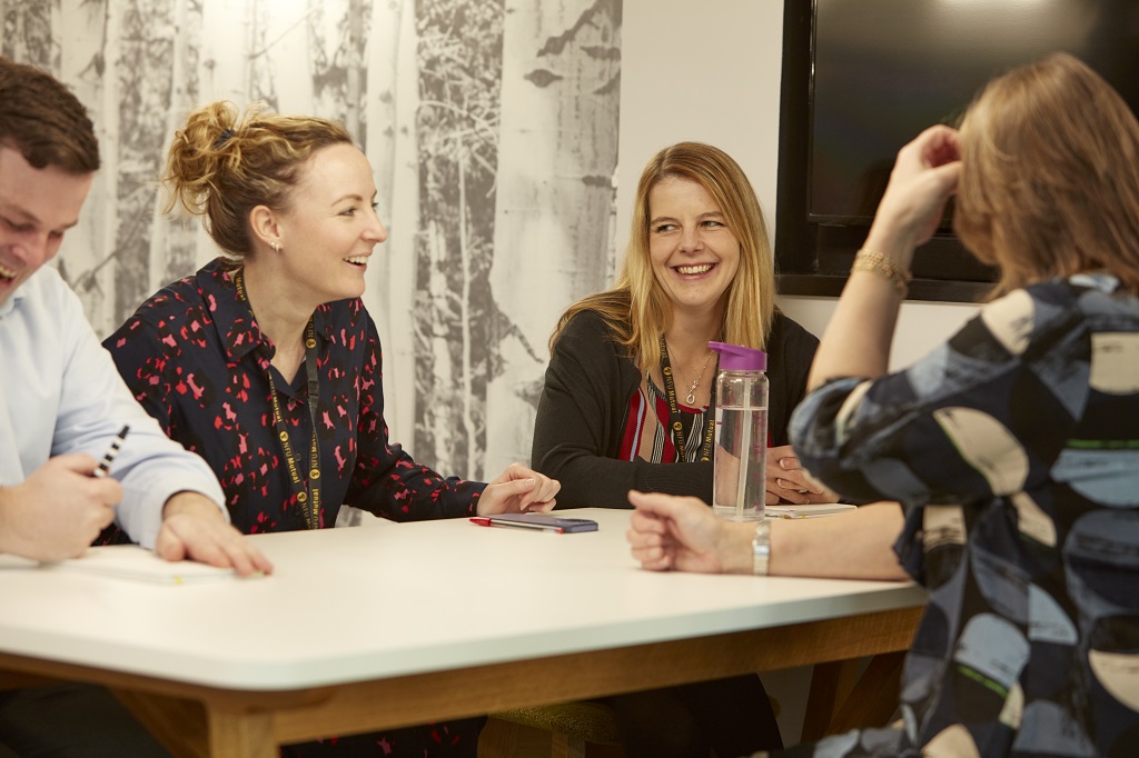 employees around a desk