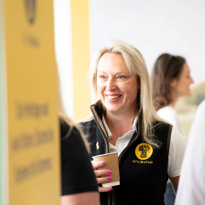 Female NFU Mutual colleague smiling