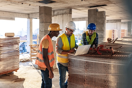 tradesmen on a building site