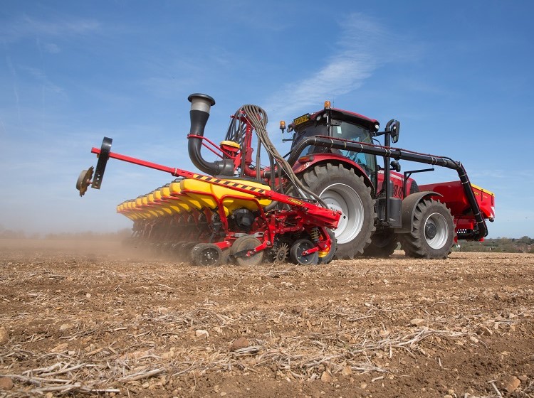 tractor and plough in a farm field