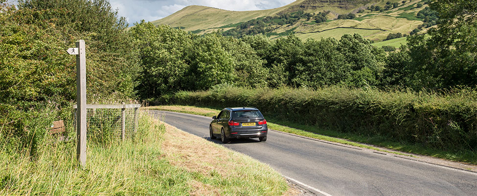 Black BMW on a country road