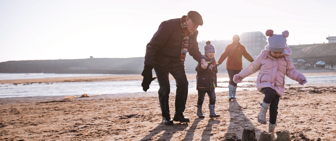 Family playing on beach